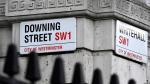 Street signs are seen at the corner of Downing Street, the official residence of British Prime Minister Boris Johnson, in London