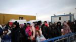 People arrive by ferry after fleeing from Russia's invasion of Ukraine, at the Isaccea-Orlivka border crossing, Romania, March 11, 2022. REUTERS/Stoyan Nenov UKRAINE-CRISIS/BORDER-ROMANIA
