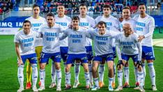 El once inicial del Real Zaragoza este domingo en Eibar, con la camiseta de apoyo a Guti.