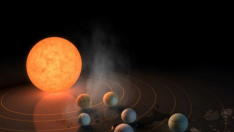 Recreación artística de la NASA de siete planetas orbitando la estrella enana roja.