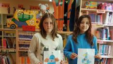 Los niños animan a los participantes de la Quebrantahuesos a dejar su huella verde