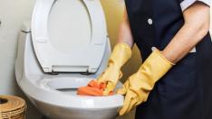 Housekeeper cleaning a hotel room