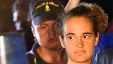 FILE PHOTO: Carola Rackete, 31-year-old Sea-Watch 3 captain, is escorted off the ship by police and taken away for questioning, in Lampedusa, Italy, June 29, 2019. REUTERS/Guglielmo Mangiapane/File Photo [[[REUTERS VOCENTO]]] EUROPE-MIGRANTS/ITALY-CAPTAIN