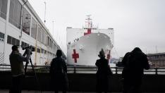 Members of the media are pictured as the USNS Comfort pulled into a berth in Manhattan during the outbreak of coronavirus disease (COVID-19), in the Manhattan borough of New York City