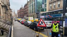 Emergency respoders are seen near a scene of reported stabbings, in Glasgow