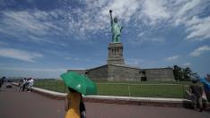 People are seen at the Statue of Liberty as New York enters Phase 4 of reopening following the outbreak of the coronavirus disease (COVID-19) in New York City