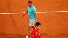 11 October 2020, France, Paris: Spanish tennis player Rafael Nadal returns the ball to Serbia's Novak Djokovic during their men's singles final tennis match of the Roland Garros 2020 French Open tennis tournament, at the Philippe Chatrier court. Photo: Anne-Christine Poujoulat/AFP/dpa11/10/2020 ONLY FOR USE IN SPAIN [[[EP]]] 11 October 2020, France, Paris: Spanish tennis player Rafael Nadal returns the ball to Serbia's Novak Djokovic during their men's singles final tennis match of the Roland Garros 2020 French Open tennis tournament, at the Philippe Chatrier court. Photo: An