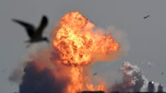 The SpaceX Starship SN9 explodes into a fireball after its high altitude test flight from test facilities in Boca Chica