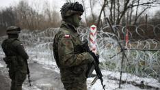 Polish soldiers patrol border area following migrants crossing attempt from Belarus