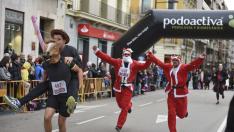 La San Silvestre en Aragón, en fotos: colorido y humor en la carrera más divertida