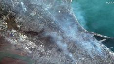 A satellite image shows buildings on fire in Mariupol