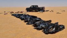 Security personnel recover bodies of migrants in the area between Kufra city and Chadian border