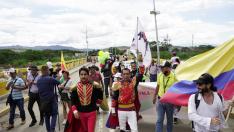 People cross the Simon Bolivar International Bridge on the border between Colombia and Venezuela to attend a political event in San Antonio del Tachira during the swearing-in ceremony of Colombia's President-elect Gustav