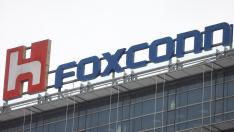 The logo of Foxconn is pictured on top of a company's building in Taipei