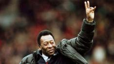 FILE PHOTO: Brazilian soccer legend Pele greets the crowd at the Manchester United versus Liverpool match during the half time interval in Manchester