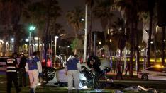 Israeli officials work at the scene of a shooting attack in Tel Aviv