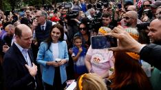 Britain's Prince William and Catherine, Princess of Wales greet well-wishers along the Long Walk outside Windsor Castle