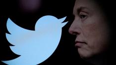 FILE PHOTO: Illustration shows Elon Musk photo and Twitter logo