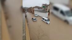 Calles y bajos de Tauste anegados por las fuertes lluvias