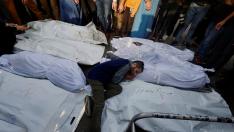 People take part in the funeral of Palestinians killed in Israeli strikes in Khan Younis