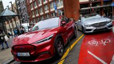 FILE PHOTO: A Ford Mustang Mach-e electric vehicle is seen plugged into a charging station in Bilbao