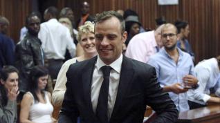 FILE PHOTO: Oscar Pistorius reacts after he was granted bail as he leaves the North Gauteng High Court in Pretoria, South Africa after his bail hearing