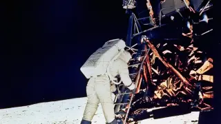 ** FILE ** Astronaut Edwin E. Aldrin, Jr., lunar module pilot, descends steps of Lunar Module ladder as he prepares to walk on the moon, July 20, 1969. He had just egressed the Lunar Module. This picture was taken by Astronaut Neil A. Armstrong, Commander, with a 70mm surface camera during the Apollo 11 extravehicular activity. (AP Photo/NASA)   MOON LANDING ANNIVERSARY