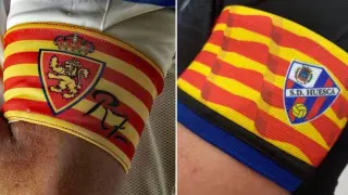 Los brazaletes de capitán del Real Zaragoza y la SD Huesca para el derbi.