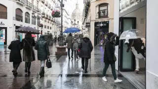 Calle Alfonso lluvia compras