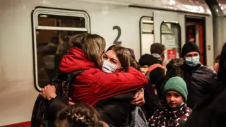 Refugees arrive by train at Berlin central station