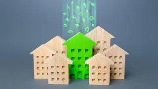 Green building stands out among the houses. Renovation and environmental improvement of old buildings. Net Zero Carbon neutrality. Environmentally friendly, energy efficient and zero emissions.