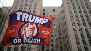 Supporters of former President Donald Trump demonstrate outside Manhattan Criminal Courthouse, on the day of Trump's planned court appearance after his indictment by a Manhattan grand jury following a probe into hush money paid to porn star Stormy Daniels, in New York City, U.S., April 4, 2023. REUTERS/Eduardo Munoz USA-TRUMP/