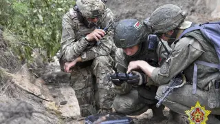 In this photo released by Belarus' Defense Ministry on Thursday, July 20, 2023, Belarusian soldiers of the Special Operations Forces (SOF) and mercenary fighters from Wagner private military company attend the weeklong maneuvers that will be conducted at a firing range near the border city of Brest, Belarus. Mercenaries from Russia's military company Wagner have launched joint drills with the Belarusian military near the border with Poland following their relocation to Belarus after their short-lived rebellion. (Belarus' Defense Ministry via AP) Associated Press/LaPresse Only Italy and Spain