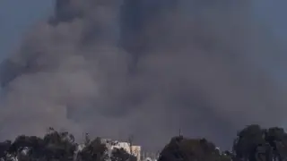 Smoke rises over Gaza during Israeli strikes, amid the ongoing conflict between Israel and the Palestinian Islamist group Hamas, as seen from southern Israel