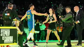 Feb 17, 2024; Indianapolis, IN, USA; Golden State Warriors guard Stephen Curry (30) and New York Liberty guard Sabrina Ionescu (20) after the Stephen vs Sebrina three-point challenge during NBA All Star Saturday Night at Lucas Oil Stadium. Mandatory Credit [[[REUTERS VOCENTO]]]
