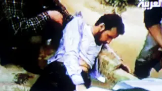 Captura de la Televisón Al Arabiya que muestra un herido libio durante las protesas.
