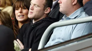 Wayne Rooney junto a su padre