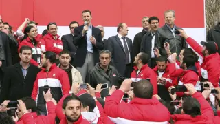 El presidente sirio, Bachar al Asad, en el centro