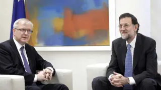 Olli Rehn y Mariano Rajoy