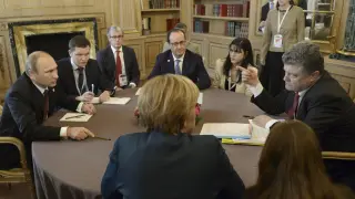 Putin y Poroshenko durante reuniones bilaterales