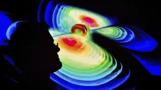 Un científico observa una representación de las ondas gravitacionales