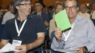 Puigdemont y Mas, durante la votación para cambiar de nombre a CDC.