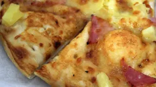 Imagen de archivo de una porción de pizza.