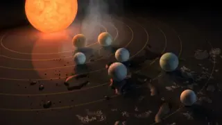 Recreación artística de la NASA de siete planetas orbitando la estrella enana roja.