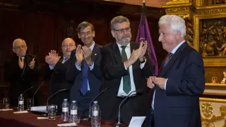 Eusebio Hernández, Jacinto Julve, Jose María Rivera y José A. Mayoral aplauden a García Vicente.