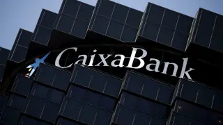 FILE PHOTO: CaixaBank's logo is seen at the company's headquarters in Barcelona, Spain, April 18, 2016. REUTERS/Albert Gea/File Photo GLOBAL BUSINESS WEEK AHEAD [[[REUTERS VOCENTO]]] CAIXABANK-RESULTS/