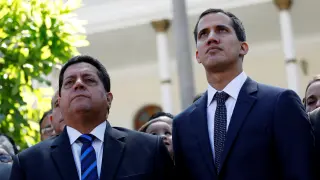 FILE PHOTO: Juan Guaido (R), new President of the National Assembly and lawmaker of the Venezuelan opposition party Popular Will (Partido Voluntad Popular), and lawmaker Edgar Zambrano of Democratic Action party (Accion Democratica), leave the congress after Guaido's swearing-in ceremony, in Caracas, Venezuela January 5, 2019. REUTERS/Manaure Quintero/File Photo VENEZUELA-POLITICS/COURT