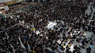 REFILE - CORRECTING GRAMMAR Anti-extradition bill protesters attend a mass demonstration after a woman was shot in the eye during a protest at Hong Kong International Airport, in Hong Kong, China August 12, 2019. REUTERS/Tyrone Siu [[[REUTERS VOCENTO]]] HONGKONG-PROTESTS/