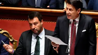 Rome (Italy), 20/08/2019.- Italian Prime Minister Giuseppe Conte (R) is flanked by Deputy Prime Ministers Matteo Salvini (L) as he addresses the Senate in Rome, Italy, 20 August 2019. Conte in his address to the senate called bringing about the government crisis irresponsible. Deputy Premier and Interior Minister Matteo Salvini and his party League pulled out from government and caused a political crisis a week ago. Conte said that the government has come to an end and that he would resign. (Italia, Roma) EFE/EPA/ETTORE FERRARI Italian Premier Giuseppe Conte addresses the Senate