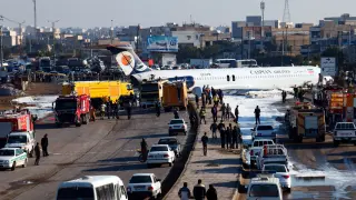 An Iranian passenger plane sits on a highway outside Mahshahr airport after skidding off the runway, in the southwestern city of Mahshahr, Iran, 27 January 2020. According to media reports the Iranian passenger plane with some 135 people on board skidded off the runway onto a road next to the airport in the southern city of Mahshahr. No one was injured in the accident, media added. EFE/EPA/MOHAMMAD ZAREI Iranian passenger plane skidds off runway onto road in southern city of Mahshahr
